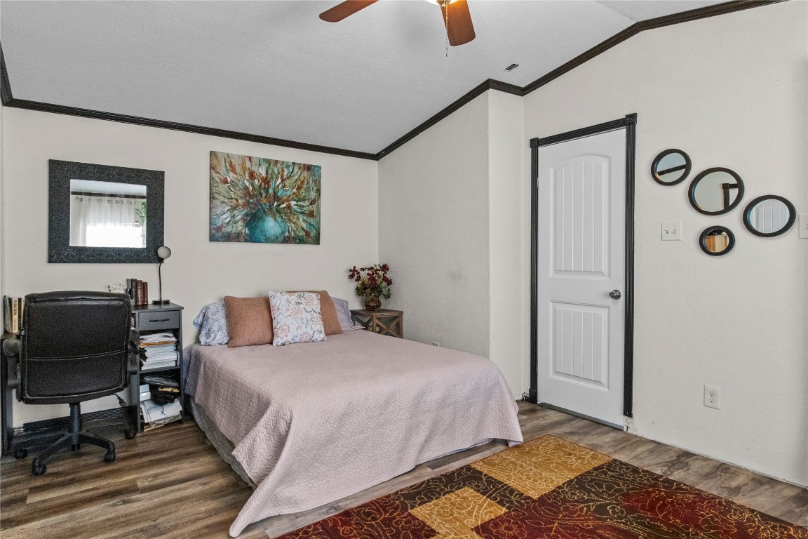 706 11th Street San Leon, TX 77539 - Photo 6 of 20 a bedroom with a bed and a chair