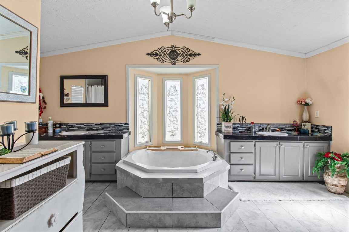 706 11th Street San Leon, TX 77539 - Photo 7 of 20 a living room with granite countertop furniture a chandelier and a kitchen