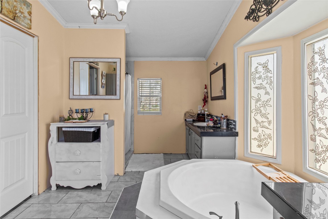 706 11th Street San Leon, TX 77539 - Photo 8 of 20 a bathroom with a sink and a bathtub