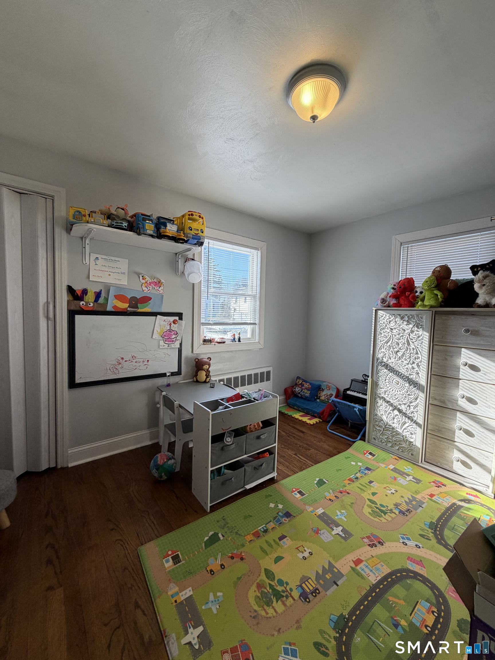 19 Maple Street Plainville, CT 06062 - Photo 15 of 25 a bedroom with a bed and a dresser