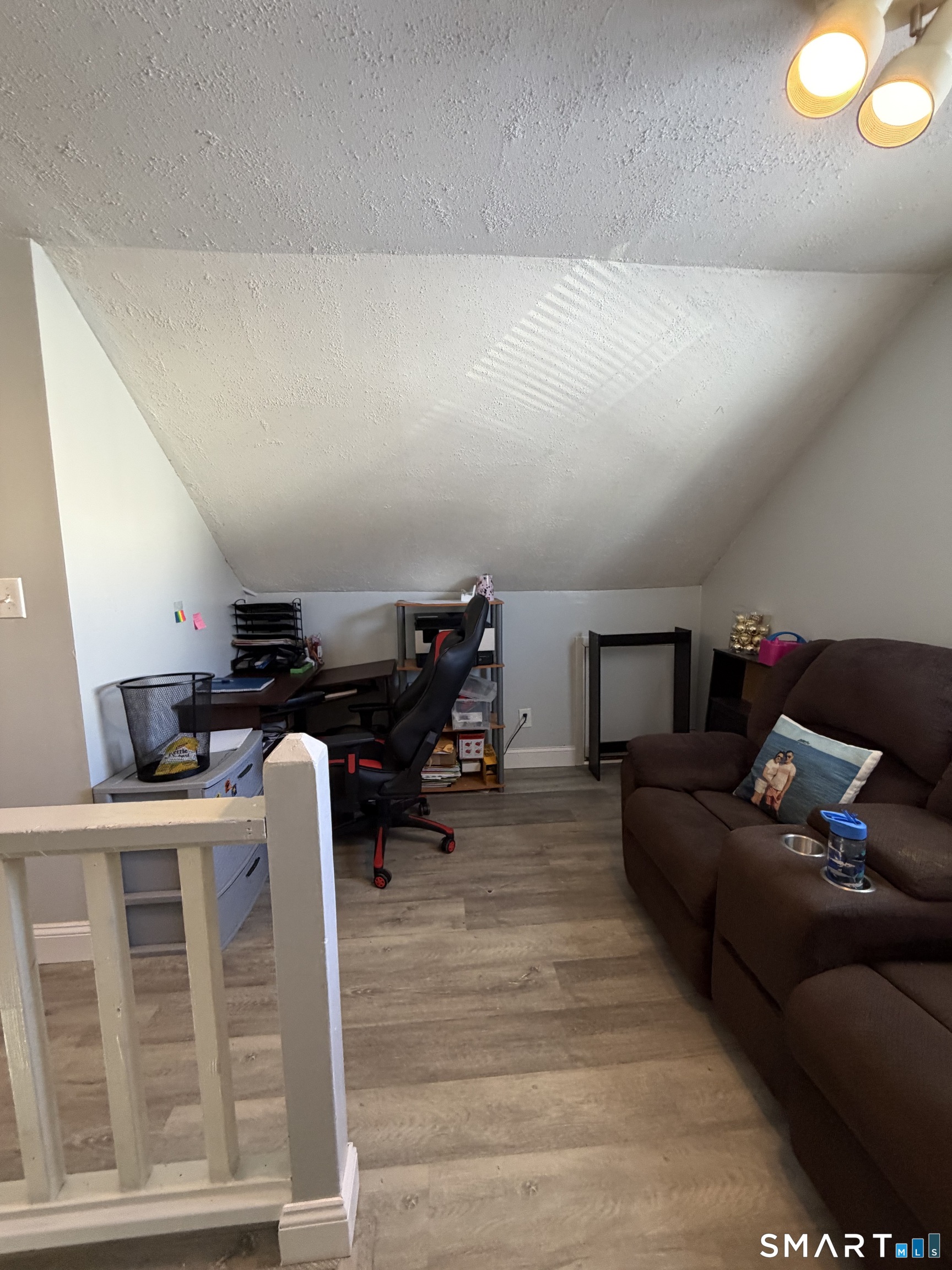19 Maple Street Plainville, CT 06062 - Photo 16 of 25 a living room with furniture and a flat screen tv