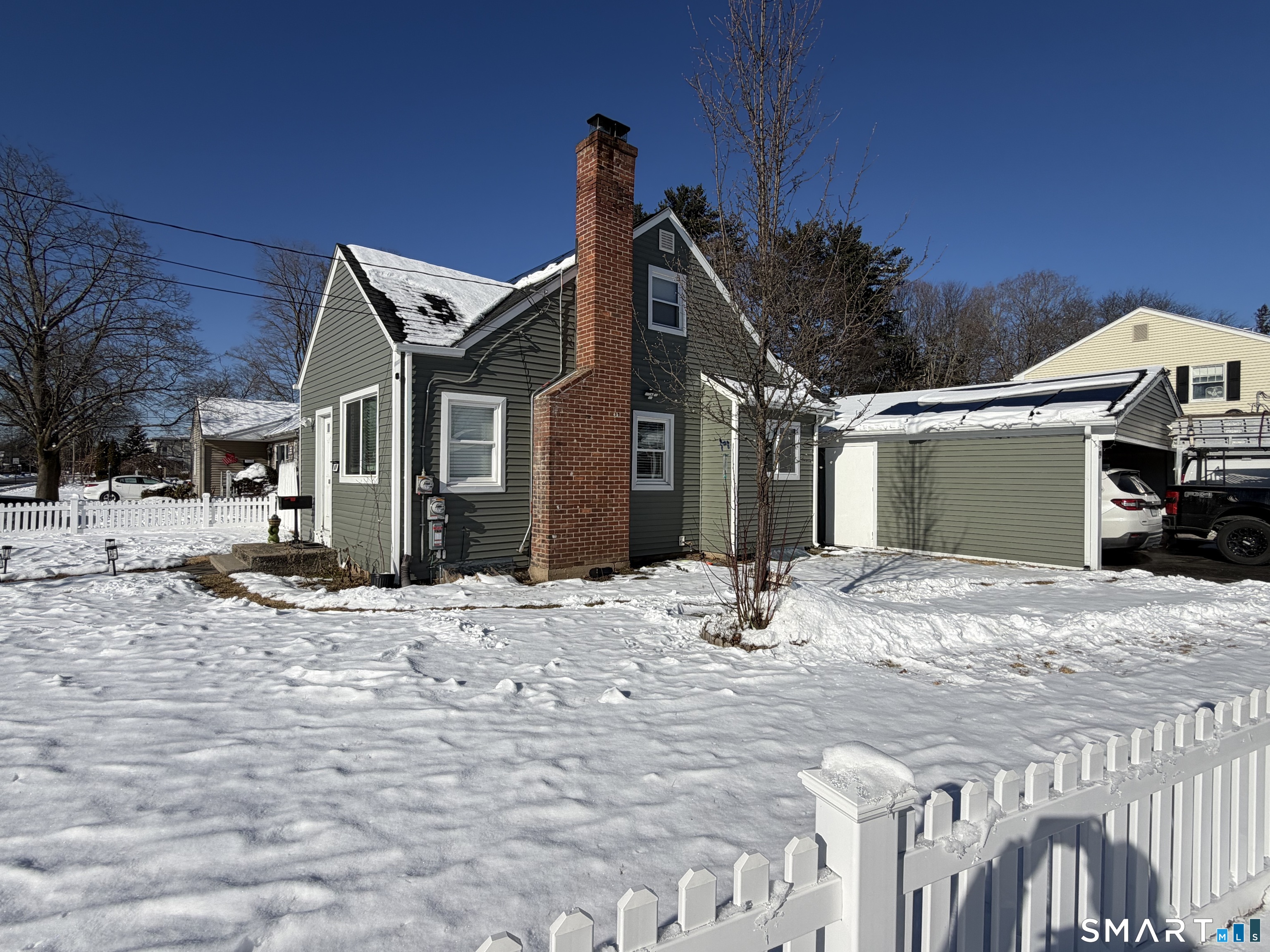 19 Maple Street Plainville, CT 06062 - Photo 2 of 25 a view of a house with snow on the side of the road