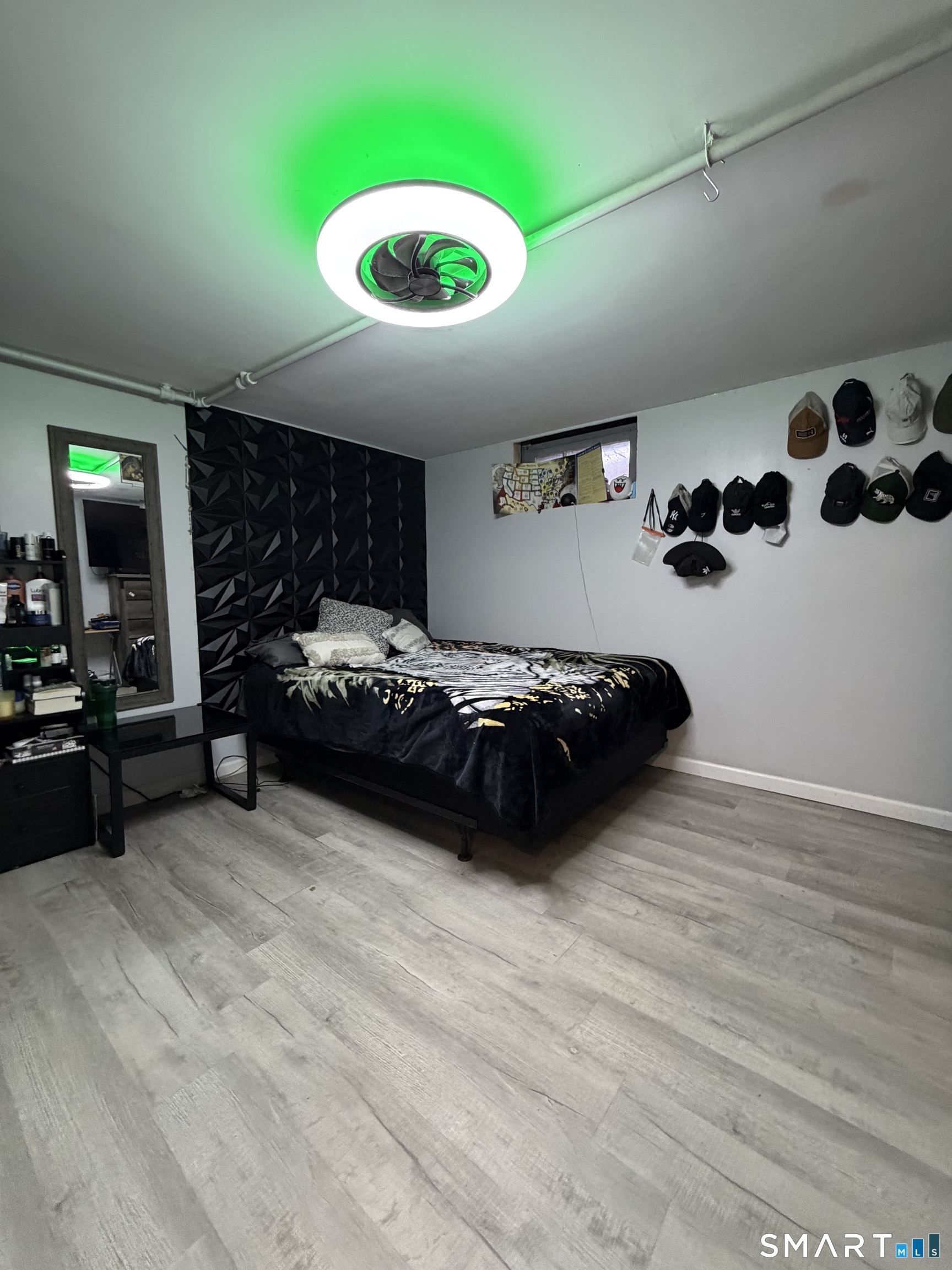 19 Maple Street Plainville, CT 06062 - Photo 21 of 25 a bedroom with a bed and a large window