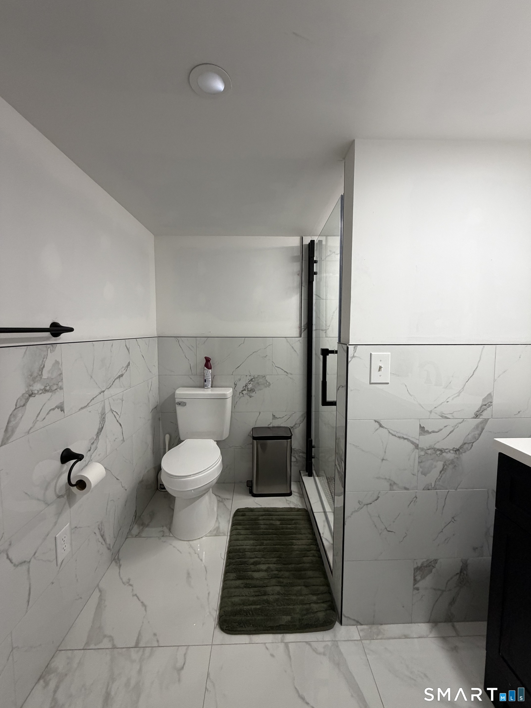 19 Maple Street Plainville, CT 06062 - Photo 22 of 25 a bathroom with a toilet and a shower