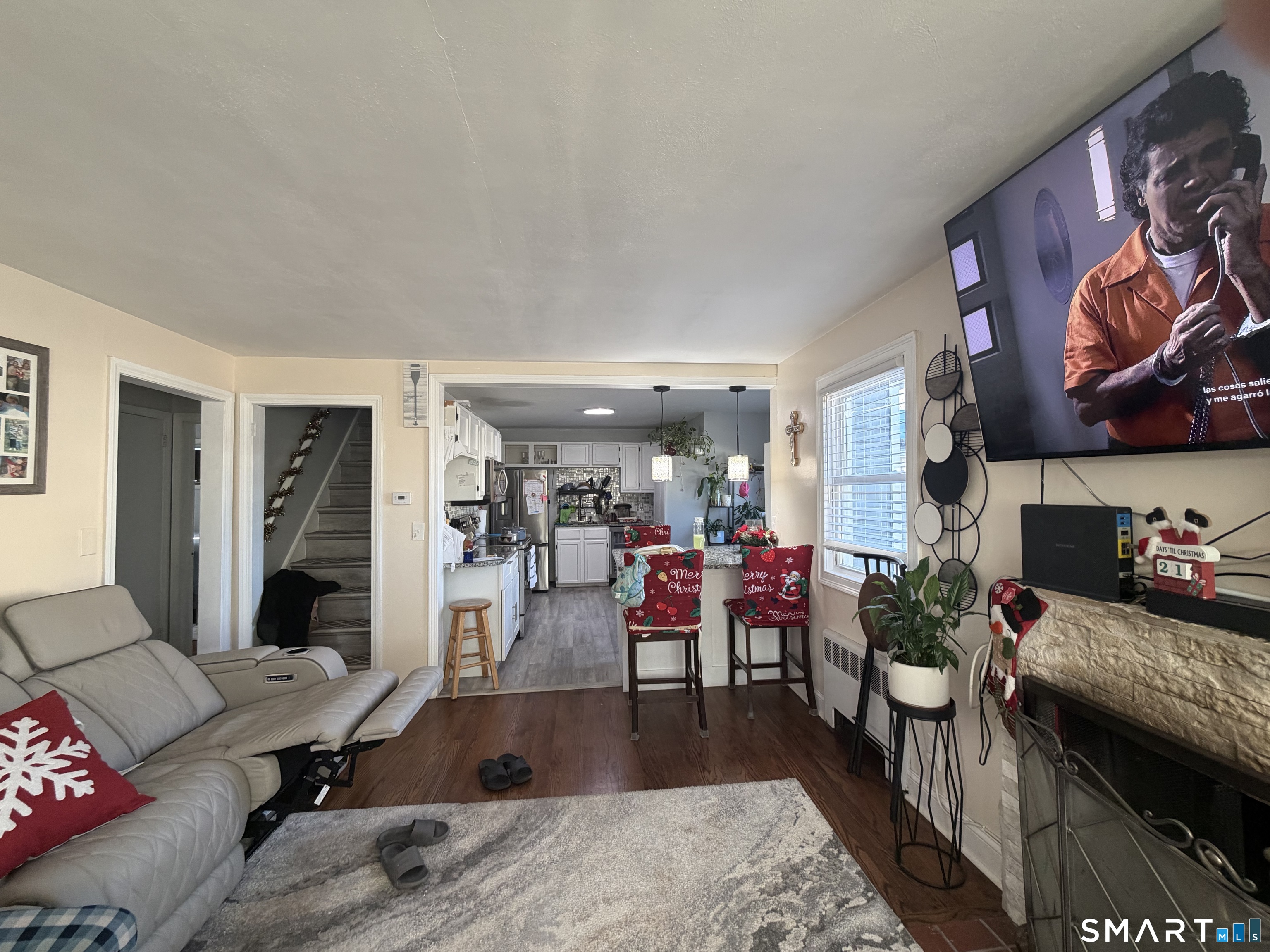 19 Maple Street Plainville, CT 06062 - Photo 5 of 25 a living room with furniture and a flat screen tv