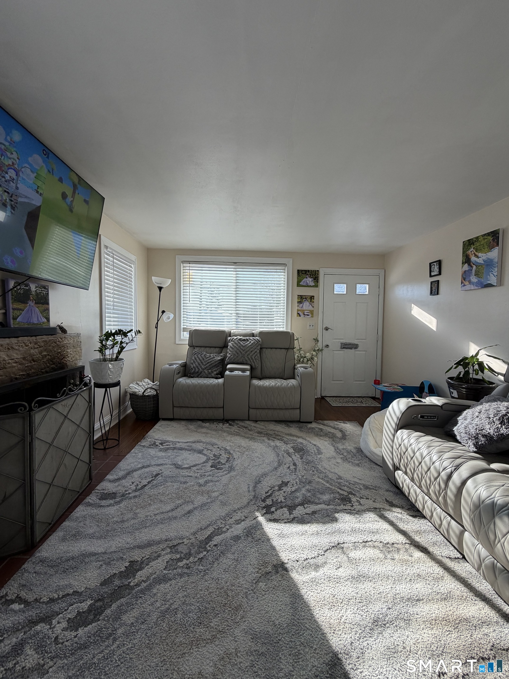 19 Maple Street Plainville, CT 06062 - Photo 6 of 25 a living room with furniture and a couch
