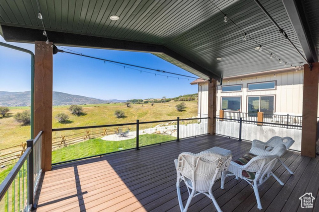 6117 North Rocky Ridge Road Peoa, UT 84061 - Photo 24 of 83 Deck featuring a mountain view and a rural view