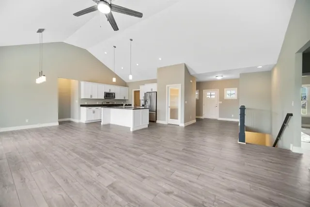 a view of kitchen with cabinets and wooden floor