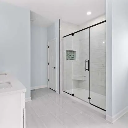a bathroom with a shower and a sink