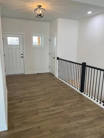 a view of entryway with wooden floor