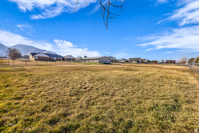 1060 West 2620th Street South Mapleton, UT 84664 - Photo 73 of 87 View of yard featuring an outbuilding, a view of countryside, and a mountain view