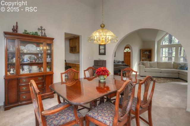 875 Bend In The Trail Road Monument, CO 80132 - Photo 9 of 36 Living and Dining room open concept