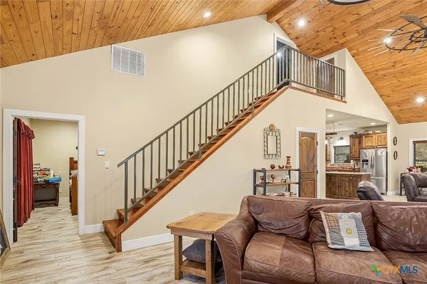 a view of livingroom and dining room with wooden floor