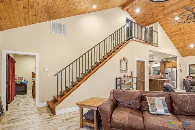 a view of livingroom and dining room with wooden floor