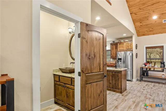 a view of a livingroom with workspace and a window