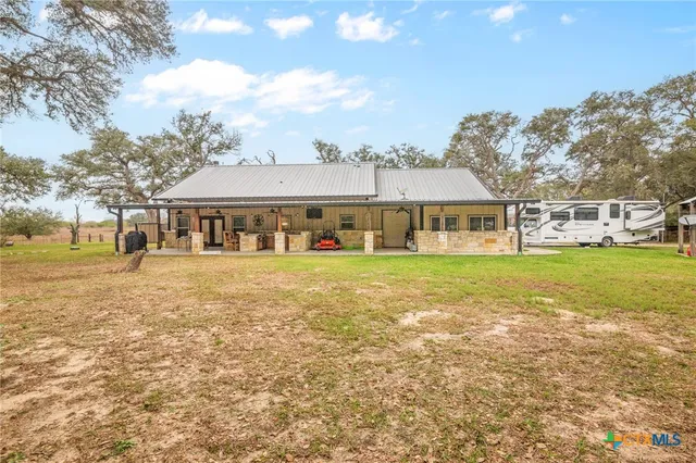 a view of house with yard