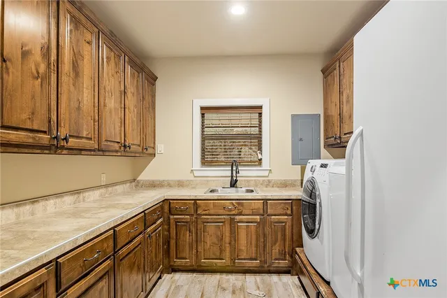 a kitchen with stainless steel appliances granite countertop a stove and a wooden floors