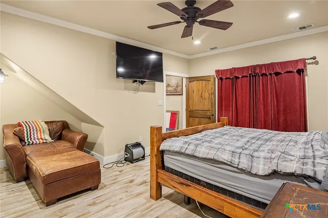 a bathroom with a granite countertop sink a toilet a mirror and shower