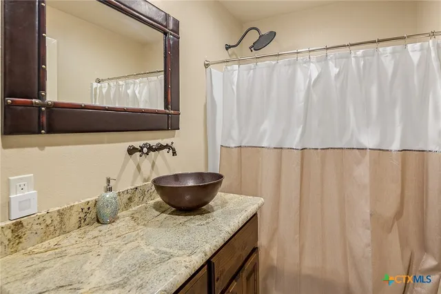 a living room with furniture a fireplace and flat screen tv