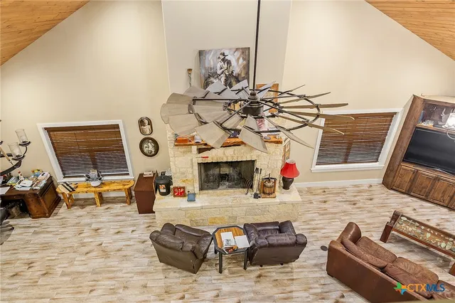 a spacious bedroom with a bed and a view of bathroom