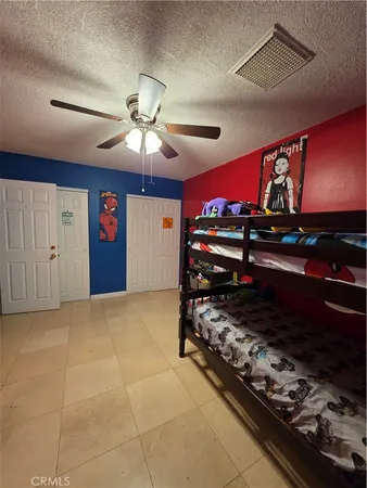a room with a bed and a chandelier