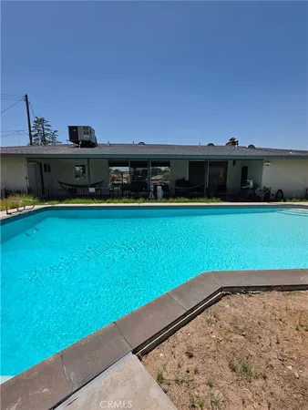 a view of a swimming pool with an ocean view