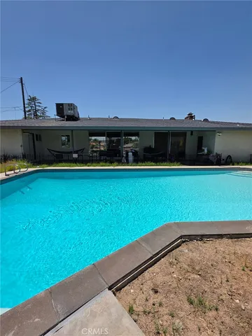 a view of a swimming pool with an ocean view