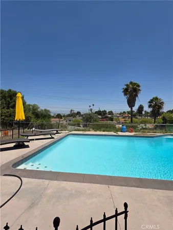 a view of a swimming pool and an outdoor space
