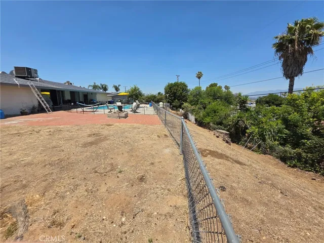 a view of a swimming pool with a deck