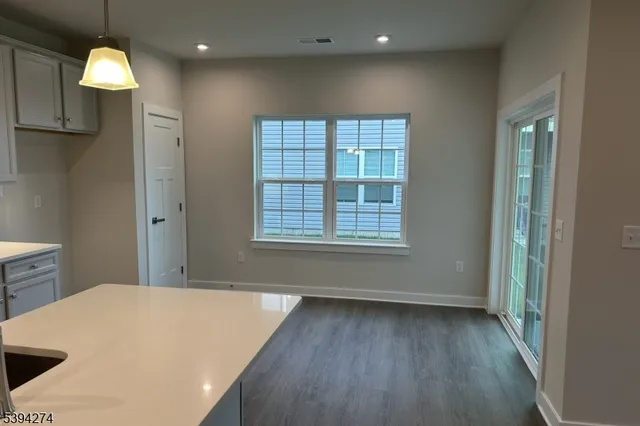 a view of a kitchen with a dishwasher and a window
