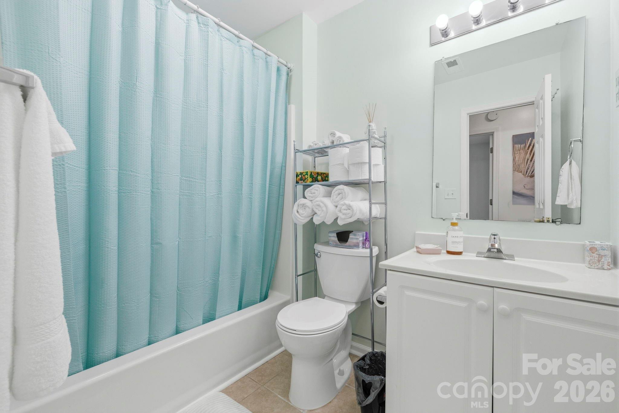 1539 Schooner Court Murrells Inlet, SC 29576 - Photo 13 of 28 a bathroom with a toilet a sink and a mirror