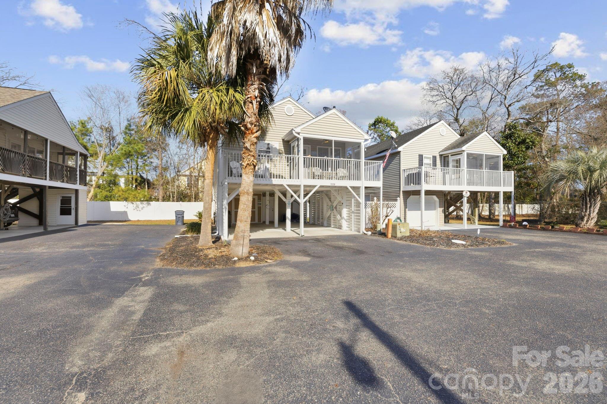 1539 Schooner Court Murrells Inlet, SC 29576 - Photo 2 of 28 a view of a town with palm trees