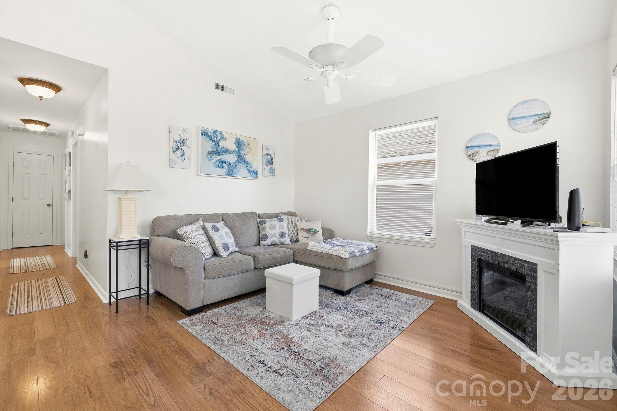 1539 Schooner Court Murrells Inlet, SC 29576 - Photo 4 of 28 a living room with fireplace furniture and a flat screen tv