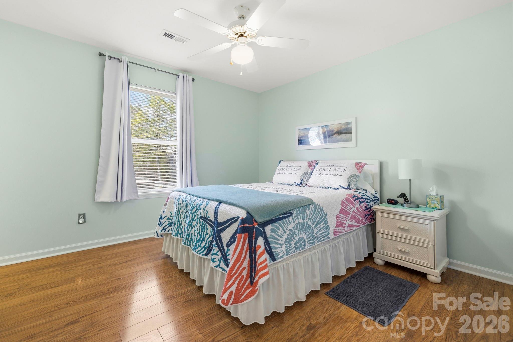 1539 Schooner Court Murrells Inlet, SC 29576 - Photo 8 of 28 a bedroom with a bed and a window