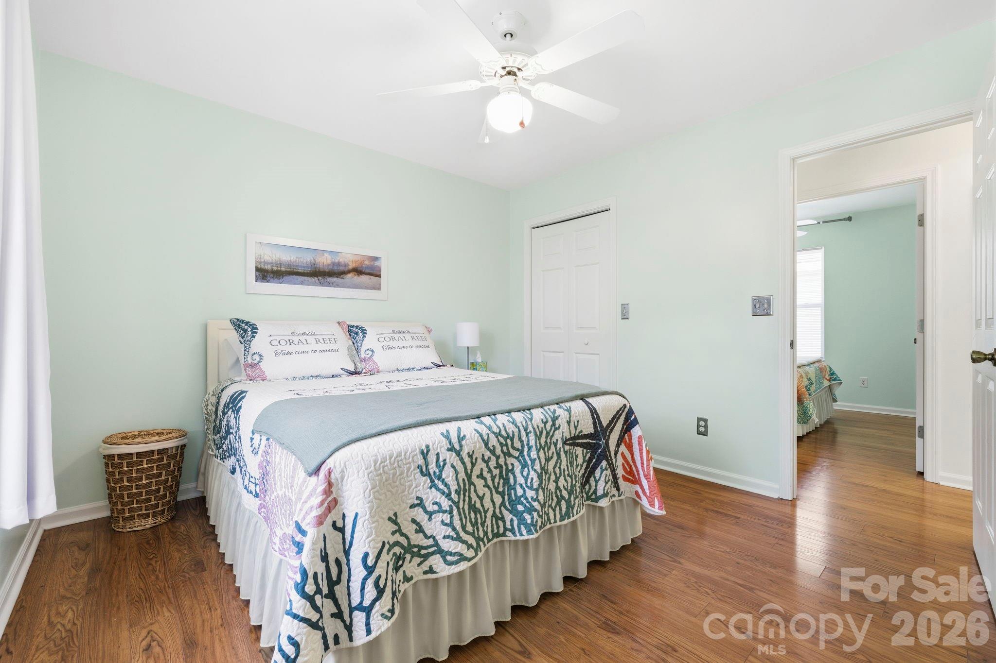 1539 Schooner Court Murrells Inlet, SC 29576 - Photo 9 of 28 a bedroom with a bed and wooden floor