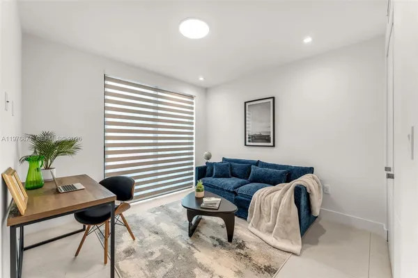 a living room with furniture and a window