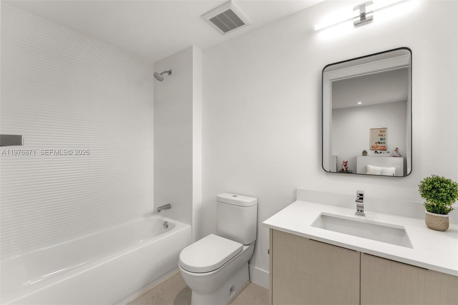 721 Southwest 11th Street, Unit F Miami, FL 33129 - Photo 15 of 36 a bathroom with a sink toilet and shower