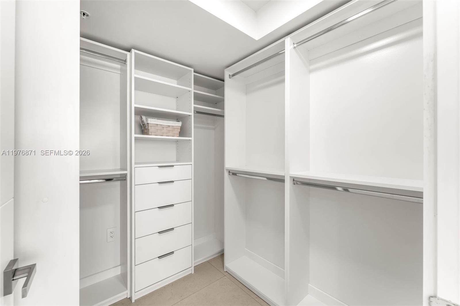 721 Southwest 11th Street, Unit F Miami, FL 33129 - Photo 21 of 36 a view of walk in closet with empty racks