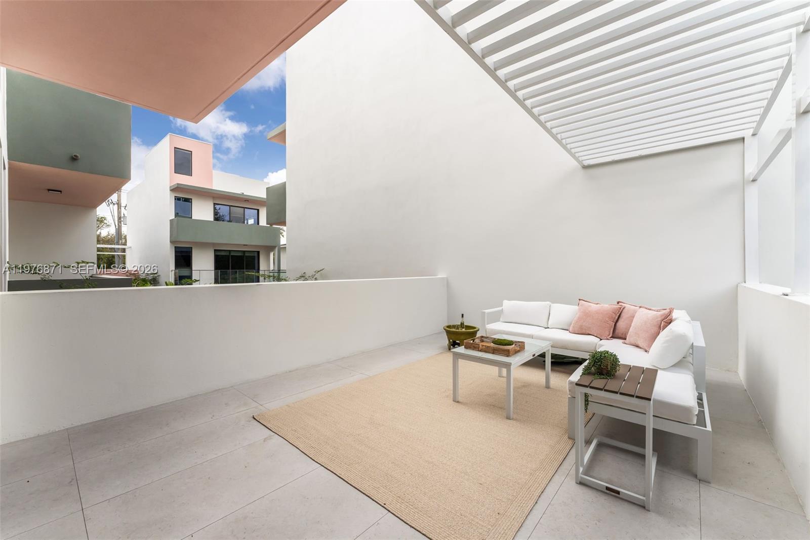 721 Southwest 11th Street, Unit F Miami, FL 33129 - Photo 22 of 36 a balcony with chairs and a table