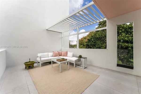 a living room with furniture and window