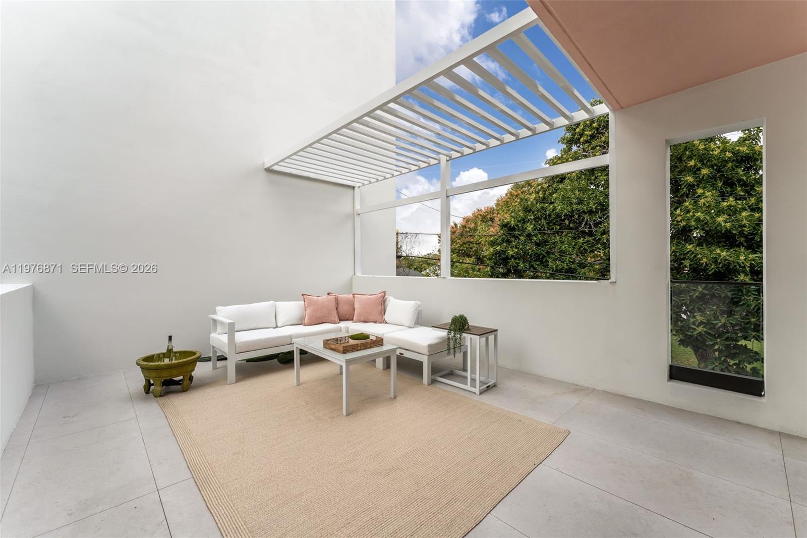 721 Southwest 11th Street, Unit F Miami, FL 33129 - Photo 23 of 36 a living room with furniture and window