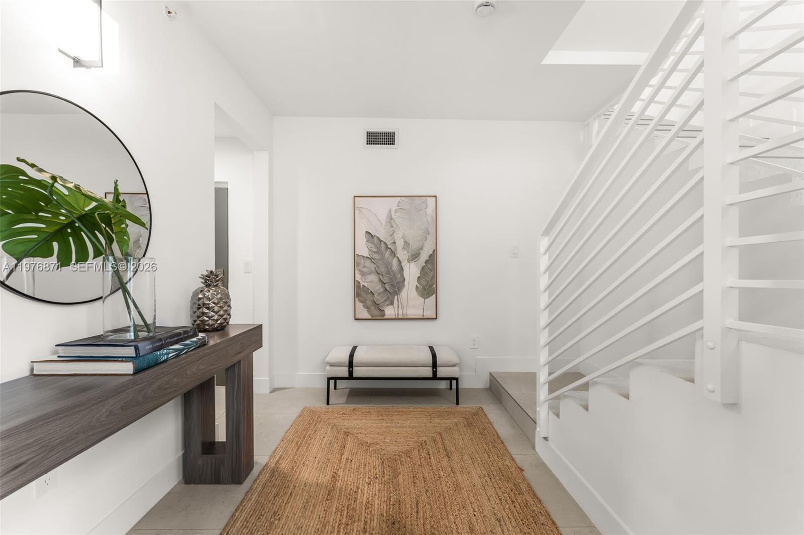 721 Southwest 11th Street, Unit F Miami, FL 33129 - Photo 4 of 36 a view of a bedroom with a table and chair