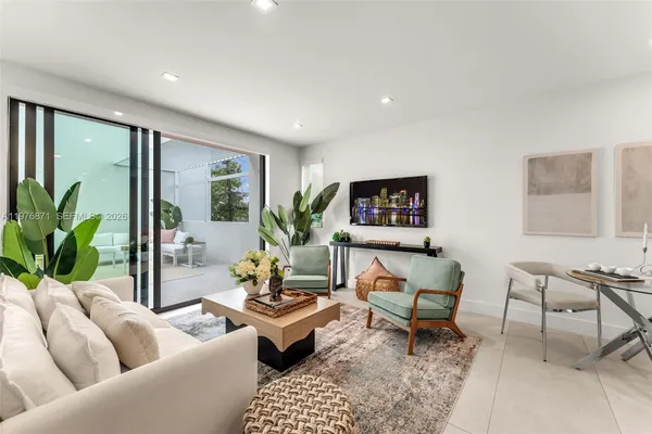 a living room with furniture and a table