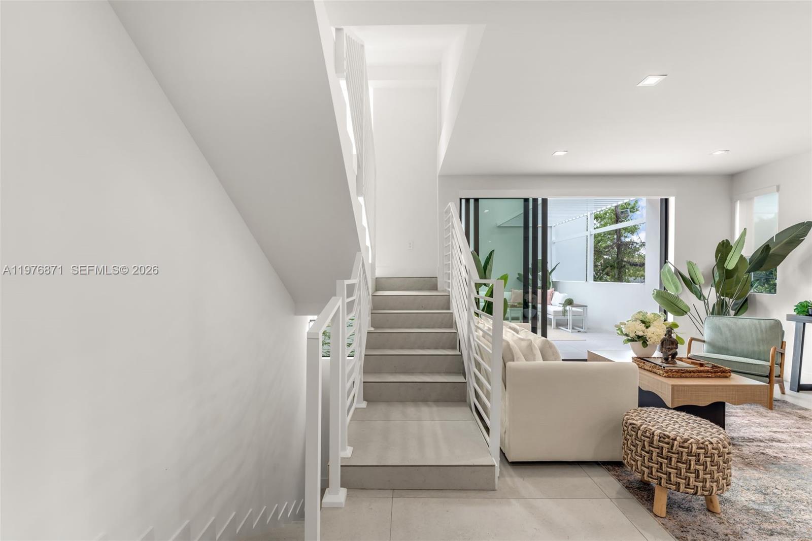 721 Southwest 11th Street, Unit F Miami, FL 33129 - Photo 7 of 36 a living room with furniture and a entryway