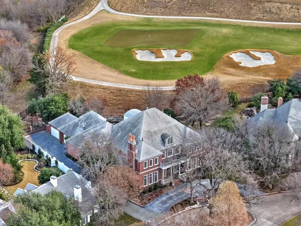 an aerial view of a house with outdoor space
