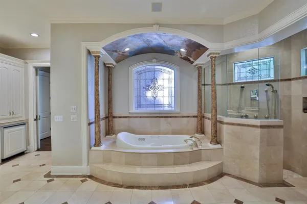 a view of a bathroom with bathtub
