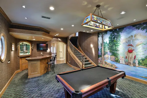 a bed room with a bed and a television