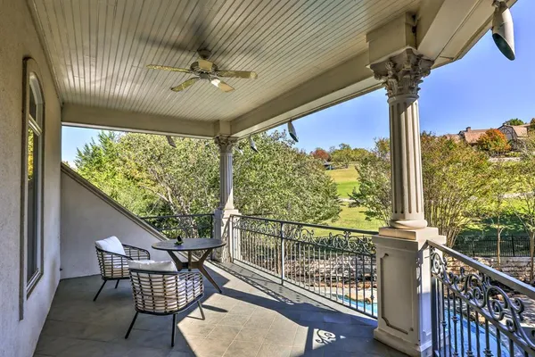 a view of a balcony with furniture
