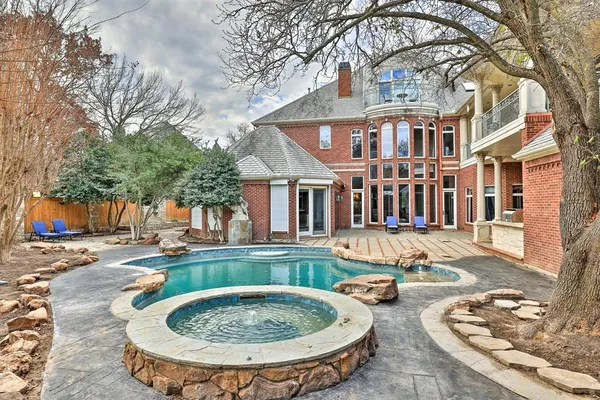 a backyard of a house with outdoor seating