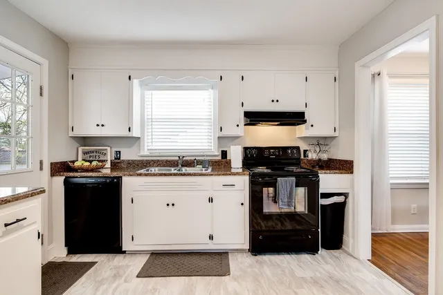 a kitchen with a stove and a refrigerator
